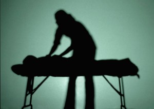 A silhouette of someone giving a massage