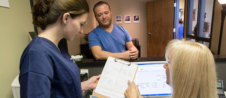 Medical Assistant Students at WellSpring learning how to help a client.