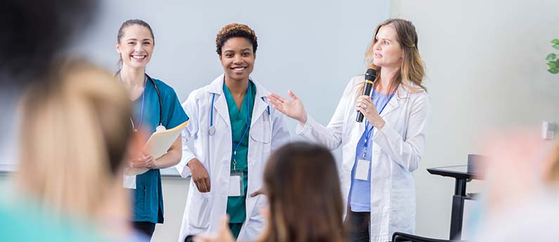 3 healthcare professionals address and audience