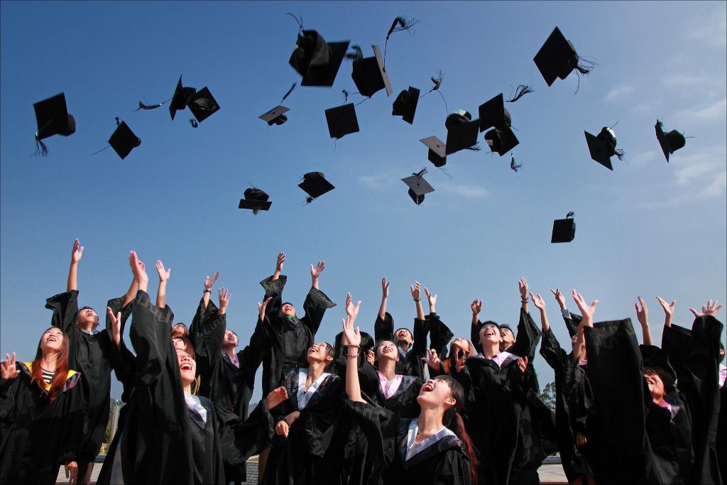 students at graduation ceremony in regalia