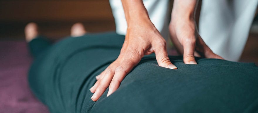 Client is receives a back massage from a Massage Therapist.